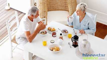 A Healthy Retired Old Couple Having Breakfast In The Morning